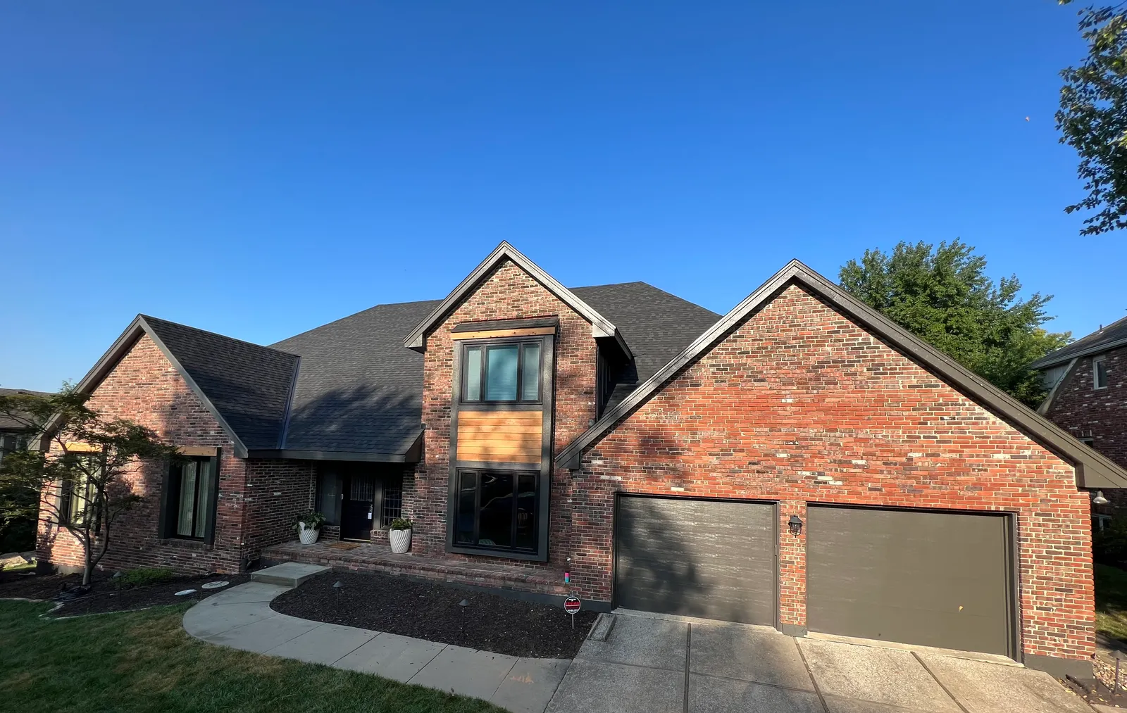 Brick home with dark trim accent