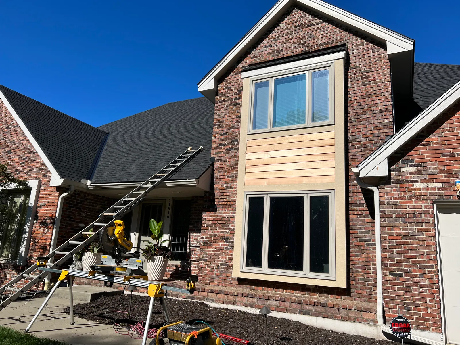 Brick home with wood siding accent