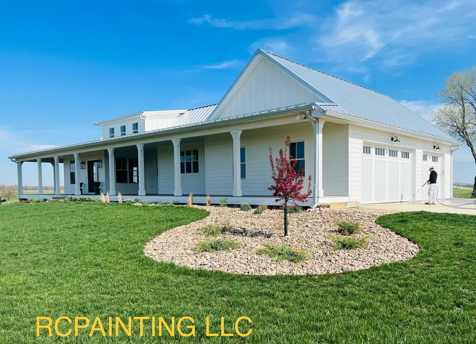 White farmhouse garage and front porch
